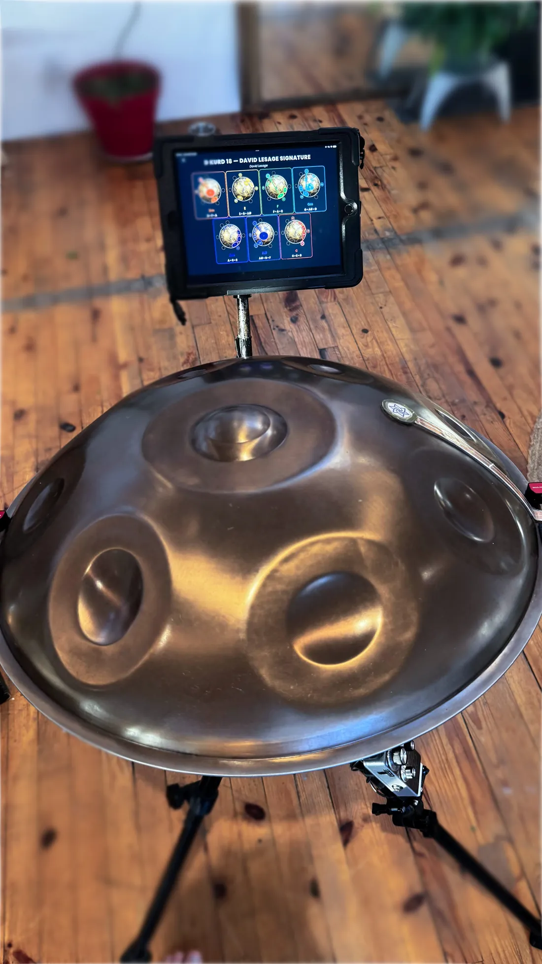 At the showroom: my acoustic Yishama handpan on its stand, the app above it, its chords drawn as constellations.